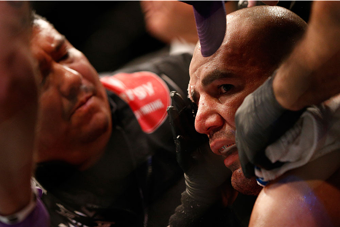 BALTIMORE, MD - APRIL 26: Glover Teixeira sits in his corner between rounds of his light heavyweight championship bout against Jon "Bones" Jones during the UFC 172 event at the Baltimore Arena on April 26, 2014 in Baltimore, Maryland. (Photo by Josh Hedg