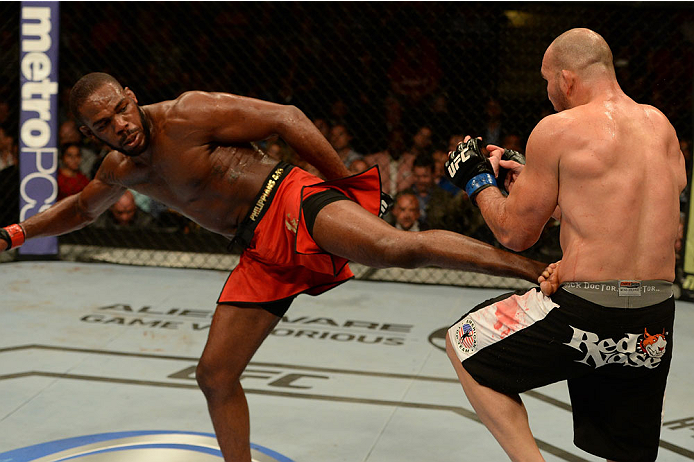 BALTIMORE, MD - APRIL 26:  (L-R) Jon "Bones" Jones kicks Glover Teixeira in their light heavyweight championship bout during the UFC 172 event at the Baltimore Arena on April 26, 2014 in Baltimore, Maryland. (Photo by Patrick Smith/Zuffa LLC/Zuffa LLC via