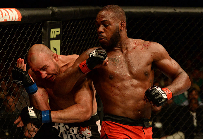 BALTIMORE, MD - APRIL 26:  (R-L) Jon "Bones" Jones elbows Glover Teixeira in their light heavyweight championship bout during the UFC 172 event at the Baltimore Arena on April 26, 2014 in Baltimore, Maryland. (Photo by Patrick Smith/Zuffa LLC/Zuffa LLC vi