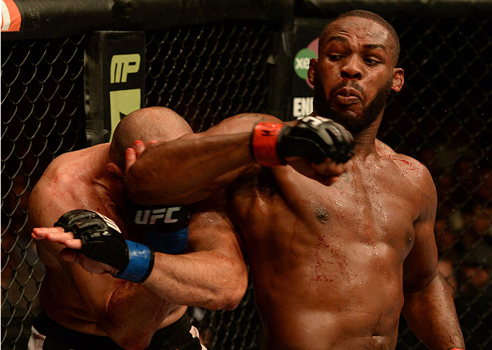 BALTIMORE, MD - APRIL 26:  (R-L) Jon "Bones" Jones elbows Glover Teixeira in their light heavyweight championship bout during the UFC 172 event at the Baltimore Arena on April 26, 2014 in Baltimore, Maryland. (Photo by Patrick Smith/Zuffa LLC/Zuffa LLC vi