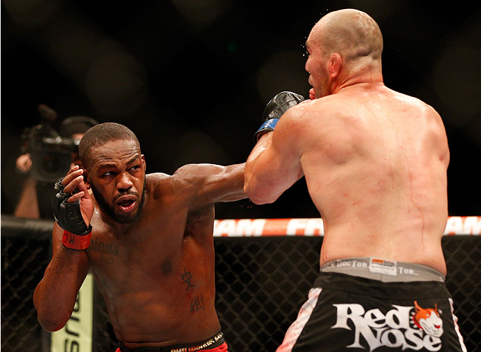 BALTIMORE, MD - APRIL 26:  (L-R) Jon "Bones" Jones punches Glover Teixeira in their light heavyweight championship bout during the UFC 172 event at the Baltimore Arena on April 26, 2014 in Baltimore, Maryland. (Photo by Josh Hedges/Zuffa LLC/Zuffa LLC via