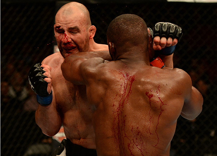 BALTIMORE, MD - APRIL 26:  (R-L) Jon "Bones" Jones elbows Glover Teixeira in their light heavyweight championship bout during the UFC 172 event at the Baltimore Arena on April 26, 2014 in Baltimore, Maryland. (Photo by Patrick Smith/Zuffa LLC/Zuffa LLC vi