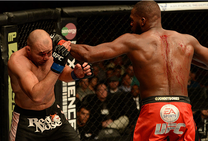 BALTIMORE, MD - APRIL 26:  (R-L) Jon "Bones" Jones punches Glover Teixeira in their light heavyweight championship bout during the UFC 172 event at the Baltimore Arena on April 26, 2014 in Baltimore, Maryland. (Photo by Patrick Smith/Zuffa LLC/Zuffa LLC v