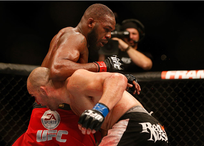 BALTIMORE, MD - APRIL 26:  (L-R) Jon "Bones" Jones elbows Glover Teixeira in their light heavyweight championship bout during the UFC 172 event at the Baltimore Arena on April 26, 2014 in Baltimore, Maryland. (Photo by Josh Hedges/Zuffa LLC/Zuffa LLC via 