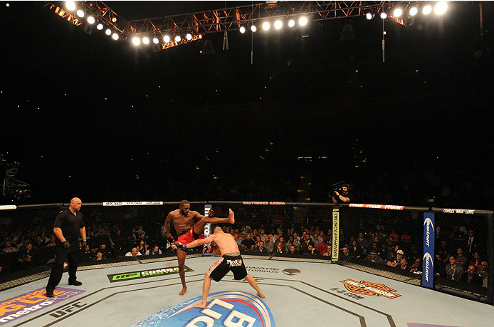 BALTIMORE, MD - APRIL 26:  (L-R) Jon "Bones" Jones kicks Glover Teixeira in their light heavyweight championship bout during the UFC 172 event at the Baltimore Arena on April 26, 2014 in Baltimore, Maryland. (Photo by Patrick Smith/Zuffa LLC/Zuffa LLC via