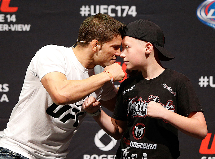 VANCOUVER, BC - JUNE 13: Josh Thomson poses for photos with young fans after a Q&A session before the UFC 174 weigh-in at Rogers Arena on June 13, 2014 in Vancouver, Canada. (Photo by Josh Hedges/Zuffa LLC/Zuffa LLC via Getty Images)