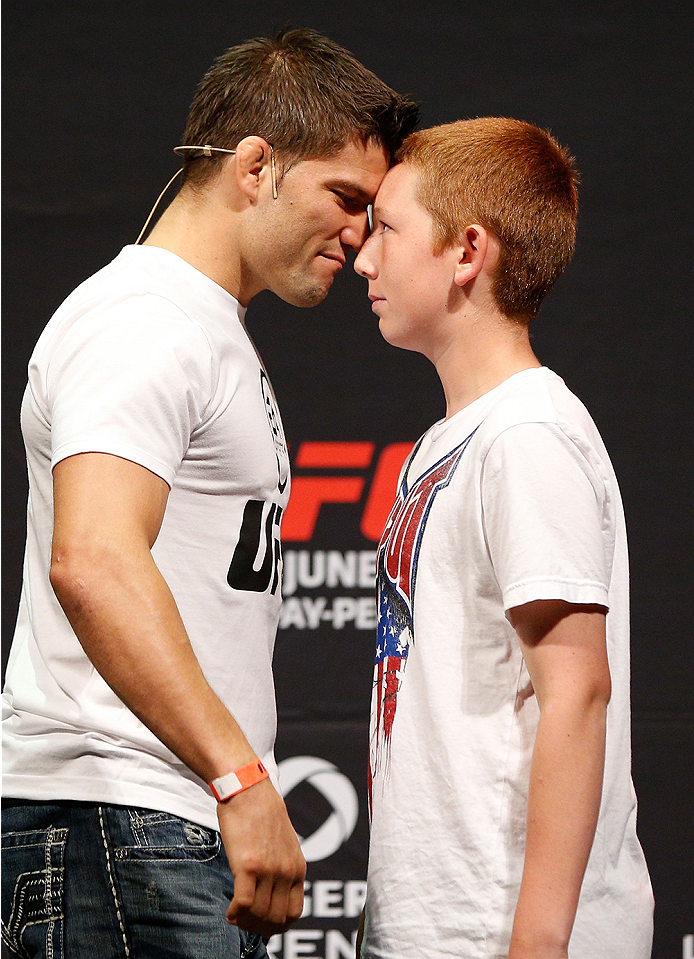 VANCOUVER, BC - JUNE 13:  Josh Thomson poses for photos with young fans after a Q&A session before the UFC 174 weigh-in at Rogers Arena on June 13, 2014 in Vancouver, Canada.  (Photo by Josh Hedges/Zuffa LLC/Zuffa LLC via Getty Images)