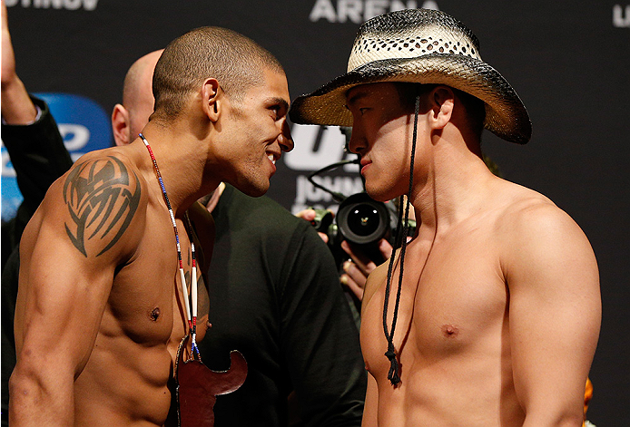 VANCOUVER, BC - JUNE 13:  (L-R) Opponents Kajan Johnson and Tae Hyun Bang face off during the UFC 174 weigh-in at Rogers Arena on June 13, 2014 in Vancouver, Canada.  (Photo by Josh Hedges/Zuffa LLC/Zuffa LLC via Getty Images)