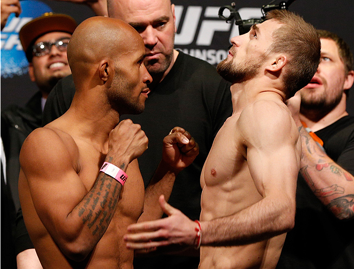 VANCOUVER, BC - JUNE 13:  (L-R) UFC flyweight champion Demetrious "Mighty Mouse" Johnson and challenger Ali Bagautinov face off during the UFC 174 weigh-in at Rogers Arena on June 13, 2014 in Vancouver, Canada.  (Photo by Josh Hedges/Zuffa LLC/Zuffa LLC v