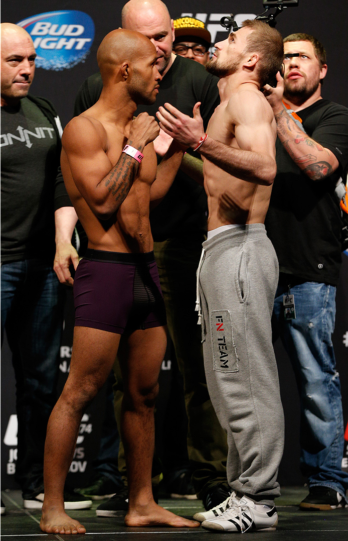 VANCOUVER, BC - JUNE 13:  (L-R) UFC flyweight champion Demetrious "Mighty Mouse" Johnson and challenger Ali Bagautinov face off during the UFC 174 weigh-in at Rogers Arena on June 13, 2014 in Vancouver, Canada.  (Photo by Josh Hedges/Zuffa LLC/Zuffa LLC v