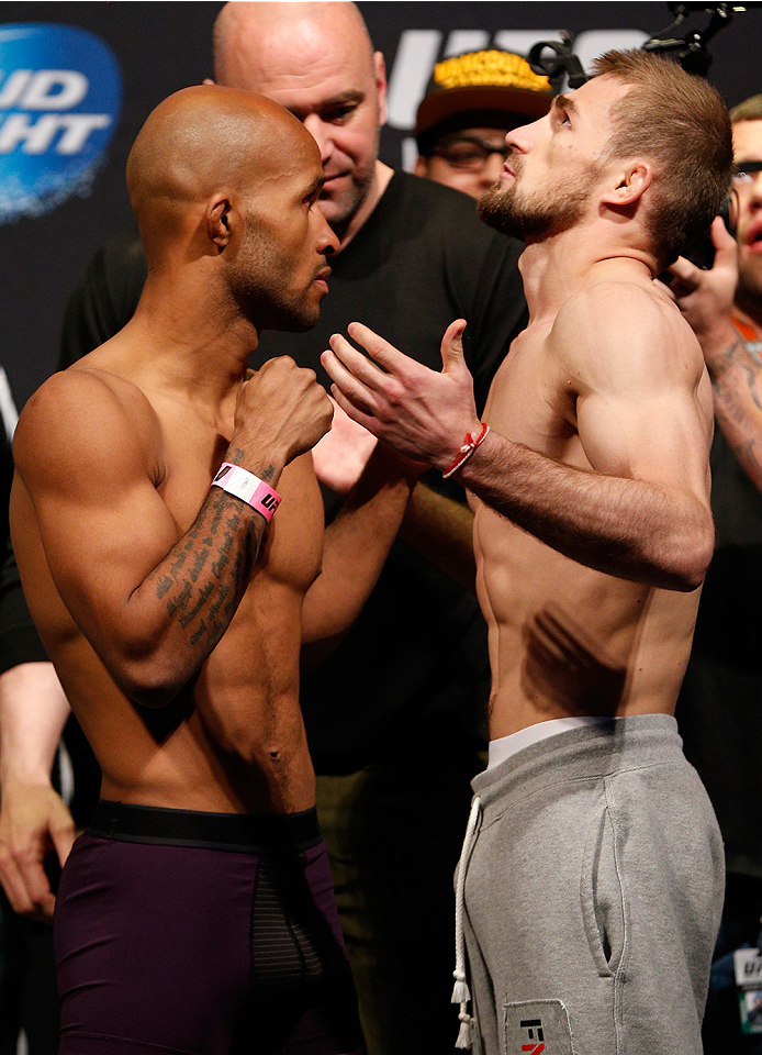 VANCOUVER, BC - JUNE 13:  (L-R) UFC flyweight champion Demetrious "Mighty Mouse" Johnson and challenger Ali Bagautinov face off during the UFC 174 weigh-in at Rogers Arena on June 13, 2014 in Vancouver, Canada.  (Photo by Josh Hedges/Zuffa LLC/Zuffa LLC v