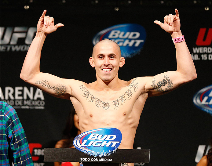 MEXICO CITY, MEXICO - NOVEMBER 14: Marlon Vera of Ecuador poses on the scale after weighing in during the UFC 180 weigh-in inside the Arena Ciudad de Mexcio on November 14, 2014 in Mexico City, Mexico. (Photo by Josh Hedges/Zuffa LLC/Zuffa LLC via Getty