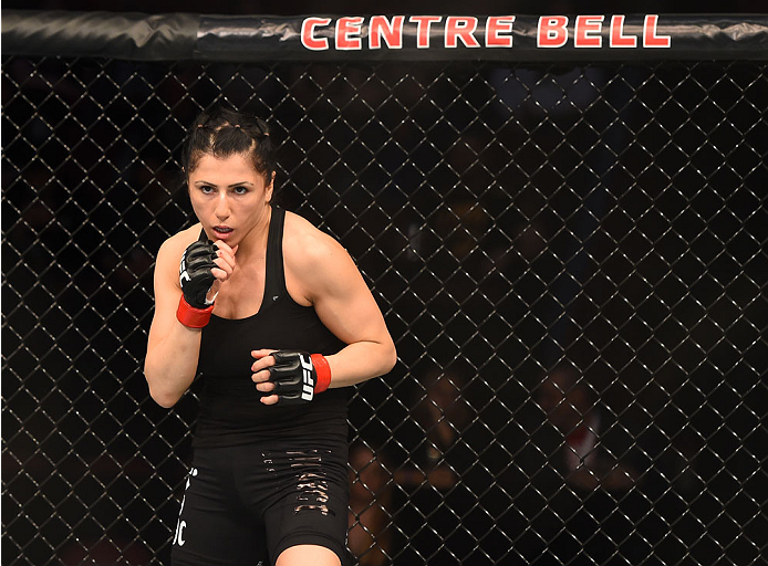 MONTREAL, QC - APRIL 25:   Randa Markos of Canada stands in the Octagon before her women's strawweight bout against Aisling Daly of Ireland during the UFC 186 event at the Bell Centre on April 25, 2015 in Montreal, Quebec, Canada. (Photo by Josh Hedges/Zu