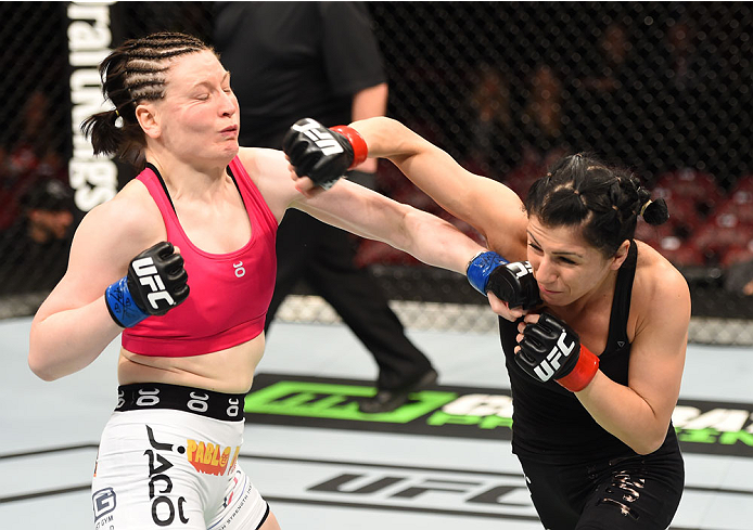 MONTREAL, QC - APRIL 25:   (R-L) Randa Markos of Canada punches Aisling Daly of Ireland in their women's strawweight bout during the UFC 186 event at the Bell Centre on April 25, 2015 in Montreal, Quebec, Canada. (Photo by Josh Hedges/Zuffa LLC/Zuffa LLC 