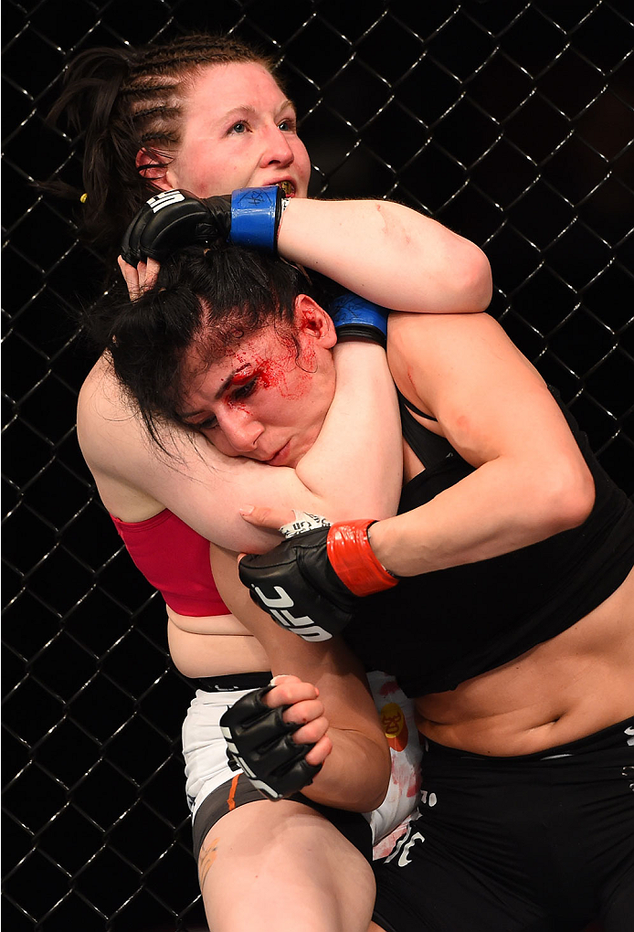 MONTREAL, QC - APRIL 25:   (L-R) Aisling Daly of Ireland attempts to secure a rear choke against Randa Markos of Canada in their women's strawweight bout during the UFC 186 event at the Bell Centre on April 25, 2015 in Montreal, Quebec, Canada. (Photo by 