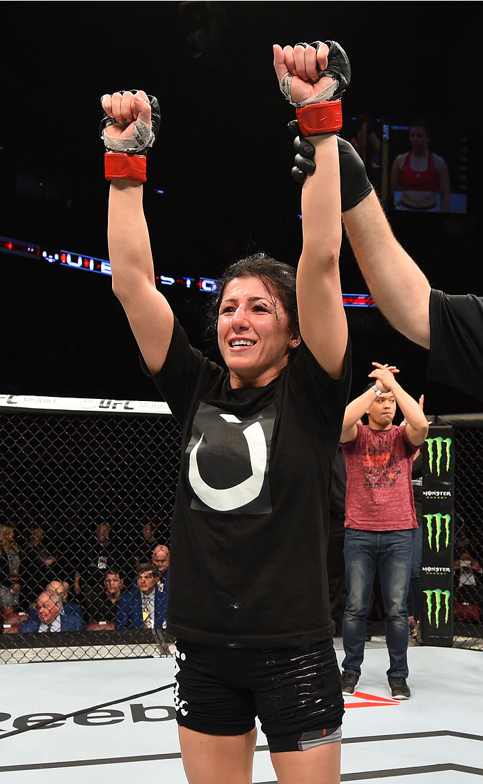 MONTREAL, QC - APRIL 25:   Randa Markos of Canada celebrates her decision victory over Aisling Daly of Ireland in their women's strawweight bout during the UFC 186 event at the Bell Centre on April 25, 2015 in Montreal, Quebec, Canada. (Photo by Josh Hedg