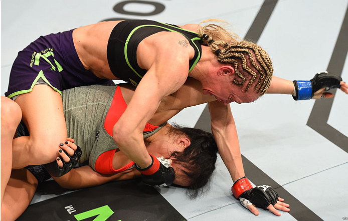 MONTREAL, QC - APRIL 25:  (L-R) Jessica Rakoczy punches Valerie Letourneau of Canada in their women's strawweight bout during the UFC 186 event at the Bell Centre on April 25, 2015 in Montreal, Quebec, Canada. (Photo by Josh Hedges/Zuffa LLC/Zuffa LLC via