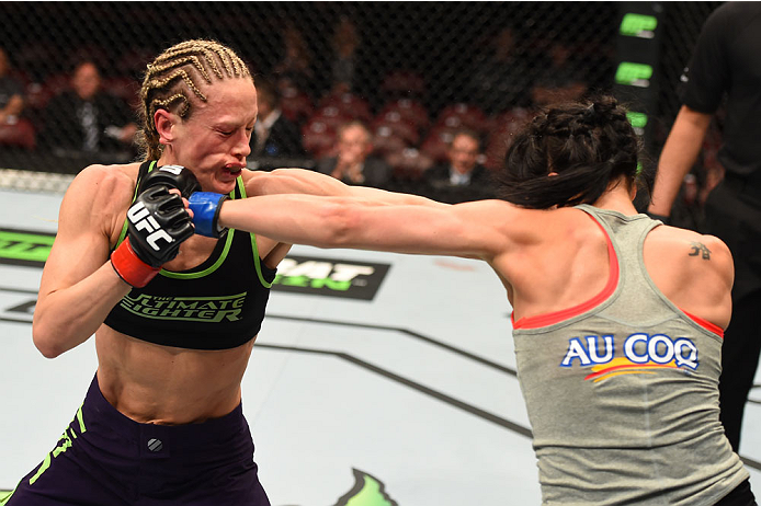 MONTREAL, QC - APRIL 25: (L-R) Jessica Rakoczy and Valerie Letourneau of Canada trade punches in their women's strawweight bout during the UFC 186 event at the Bell Centre on April 25, 2015 in Montreal, Quebec, Canada. (Photo by Josh Hedges/Zuffa LLC/Zu