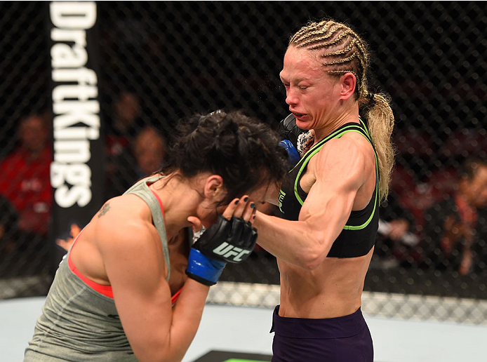 MONTREAL, QC - APRIL 25:   (R-L) Jessica Rakoczy punches Valerie Letourneau of Canada in their women's strawweight bout during the UFC 186 event at the Bell Centre on April 25, 2015 in Montreal, Quebec, Canada. (Photo by Josh Hedges/Zuffa LLC/Zuffa LLC vi