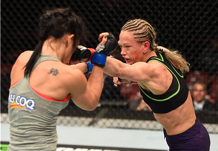 MONTREAL, QC - APRIL 25:   (R-L) Jessica Rakoczy punches Valerie Letourneau of Canada in their women's strawweight bout during the UFC 186 event at the Bell Centre on April 25, 2015 in Montreal, Quebec, Canada. (Photo by Josh Hedges/Zuffa LLC/Zuffa LLC vi