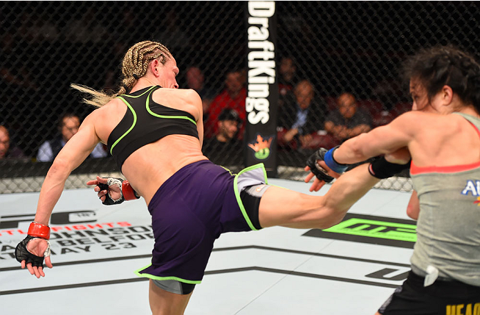 MONTREAL, QC - APRIL 25:   (L-R) Jessica Rakoczy kicks Valerie Letourneau of Canada in their women's strawweight bout during the UFC 186 event at the Bell Centre on April 25, 2015 in Montreal, Quebec, Canada. (Photo by Josh Hedges/Zuffa LLC/Zuffa LLC via 