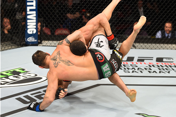 MONTREAL, QC - APRIL 25:   (L-R) Nordine Taleb of Canada takes down Chris Clements of Canada in their welterweight bout during the UFC 186 event at the Bell Centre on April 25, 2015 in Montreal, Quebec, Canada. (Photo by Josh Hedges/Zuffa LLC/Zuffa LLC vi