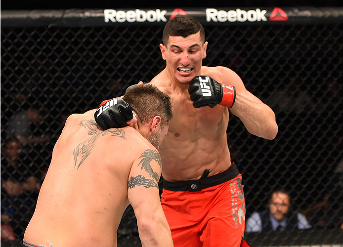 MONTREAL, QC - APRIL 25:   (R-L) Nordine Taleb of Canada punches Chris Clements of Canada in their welterweight bout during the UFC 186 event at the Bell Centre on April 25, 2015 in Montreal, Quebec, Canada. (Photo by Josh Hedges/Zuffa LLC/Zuffa LLC via G