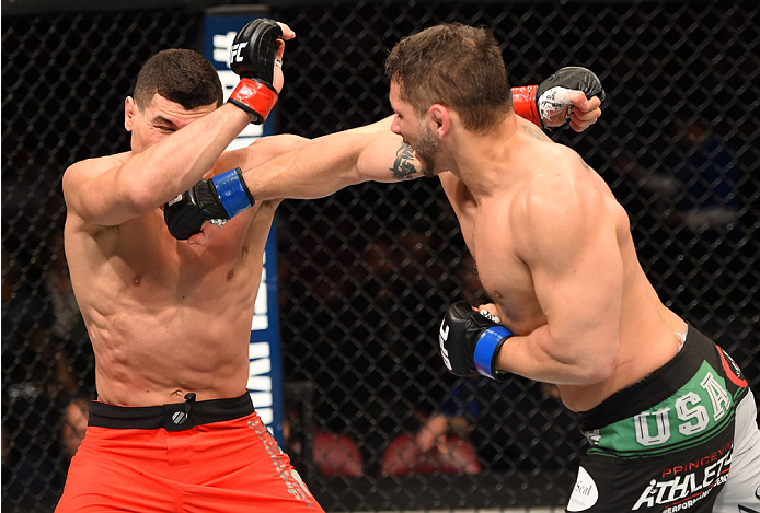 MONTREAL, QC - APRIL 25:   (R-L) Chris Clements of Canada punches Nordine Taleb of Canada in their welterweight bout during the UFC 186 event at the Bell Centre on April 25, 2015 in Montreal, Quebec, Canada. (Photo by Josh Hedges/Zuffa LLC/Zuffa LLC via G