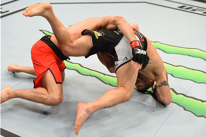 MONTREAL, QC - APRIL 25:   (L-R) Nordine Taleb of Canada takes down Chris Clements of Canada in their welterweight bout during the UFC 186 event at the Bell Centre on April 25, 2015 in Montreal, Quebec, Canada. (Photo by Josh Hedges/Zuffa LLC/Zuffa LLC vi