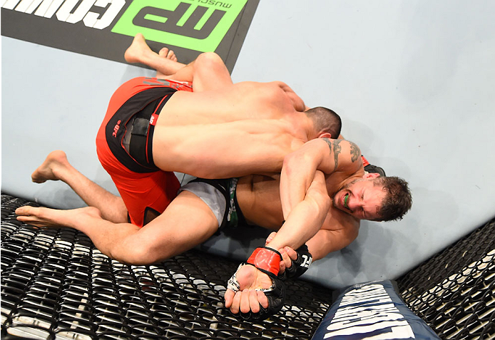 MONTREAL, QC - APRIL 25:   (R-L) Chris Clements of Canada attempts to secure an arm lock submission against Nordine Taleb of Canada in their welterweight bout during the UFC 186 event at the Bell Centre on April 25, 2015 in Montreal, Quebec, Canada. (Phot