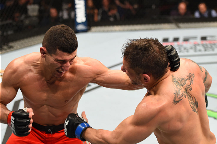 MONTREAL, QC - APRIL 25:   (L-R) Nordine Taleb of Canada punches Chris Clements of Canada in their welterweight bout during the UFC 186 event at the Bell Centre on April 25, 2015 in Montreal, Quebec, Canada. (Photo by Josh Hedges/Zuffa LLC/Zuffa LLC via G