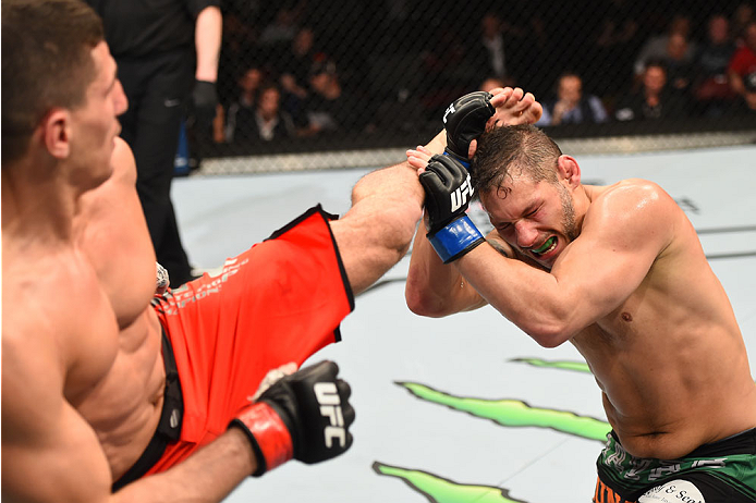 MONTREAL, QC - APRIL 25:   (L-R) Nordine Taleb of Canada kicks Chris Clements of Canada in their welterweight bout during the UFC 186 event at the Bell Centre on April 25, 2015 in Montreal, Quebec, Canada. (Photo by Josh Hedges/Zuffa LLC/Zuffa LLC via Get