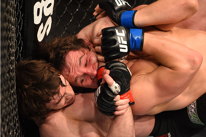 MONTREAL, QC - APRIL 25:   (L-R) Olivier Aubin-Mercier of Canada attempts to secure a rear choke against David Michaud of the United States in their lightweight bout during the UFC 186 event at the Bell Centre on April 25, 2015 in Montreal, Quebec, Canada