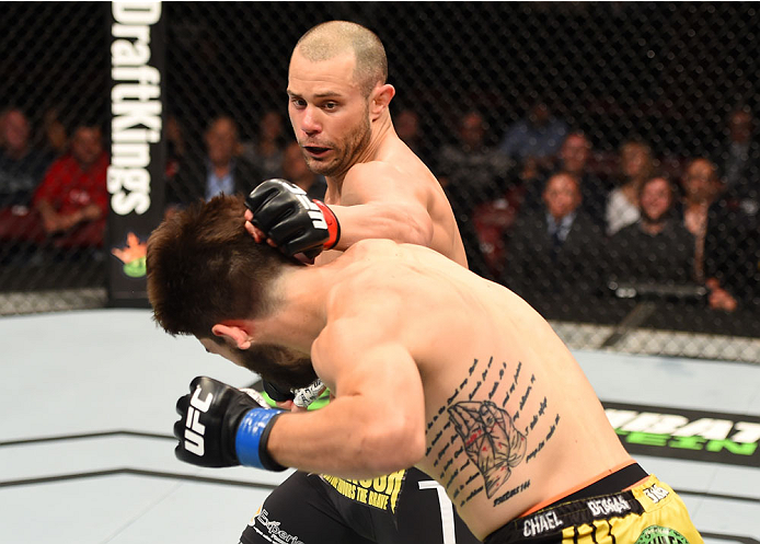 MONTREAL, QC - APRIL 25:  (R-L) Chad Laprise of Canada punches Bryan Barberena of the United States in their lightweight bout during the UFC 186 event at the Bell Centre on April 25, 2015 in Montreal, Quebec, Canada. (Photo by Josh Hedges/Zuffa LLC/Zuffa 