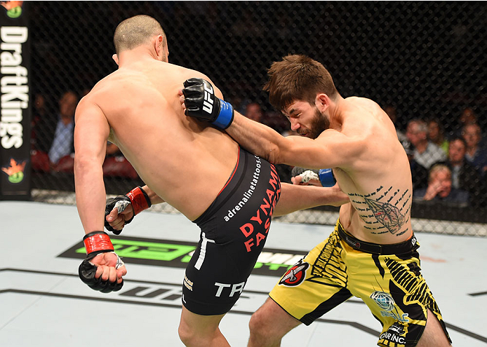 MONTREAL, QC - APRIL 25:   (L-R) Chad Laprise of Canada kicks Bryan Barberena of the United States in their lightweight bout during the UFC 186 event at the Bell Centre on April 25, 2015 in Montreal, Quebec, Canada. (Photo by Josh Hedges/Zuffa LLC/Zuffa L