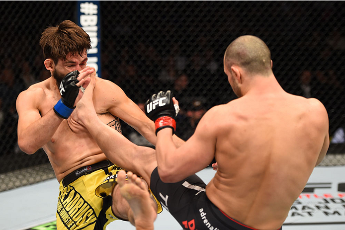 MONTREAL, QC - APRIL 25:  (R-L) Chad Laprise of Canada kicks Bryan Barberena of the United States in their lightweight bout during the UFC 186 event at the Bell Centre on April 25, 2015 in Montreal, Quebec, Canada. (Photo by Josh Hedges/Zuffa LLC/Zuffa LL