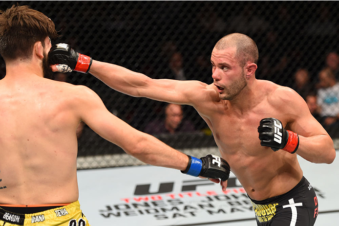 MONTREAL, QC - APRIL 25: (R-L) Chad Laprise of Canada punches Bryan Barberena of the United States in their lightweight bout during the UFC 186 event at the Bell Centre on April 25, 2015 in Montreal, Quebec, Canada. (Photo by Josh Hedges/Zuffa LLC/Zuffa
