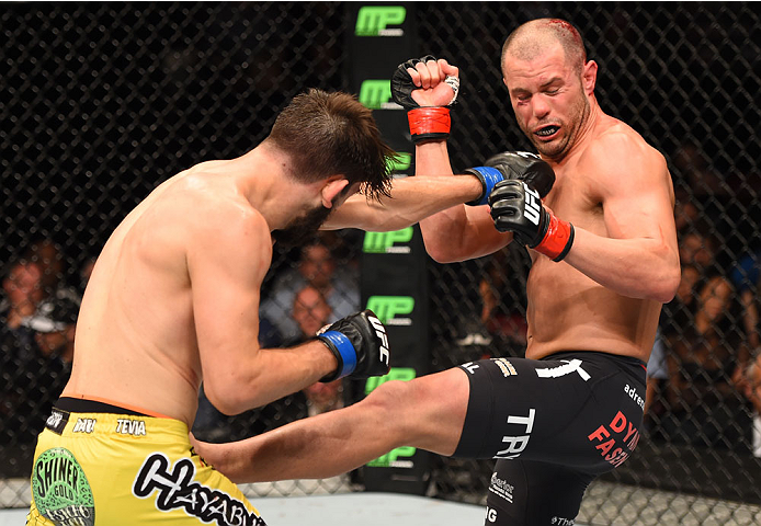 MONTREAL, QC - APRIL 25:   (L-R) Bryan Barberena of the United States punches Chad Laprise of Canada in their lightweight bout during the UFC 186 event at the Bell Centre on April 25, 2015 in Montreal, Quebec, Canada. (Photo by Josh Hedges/Zuffa LLC/Zuffa