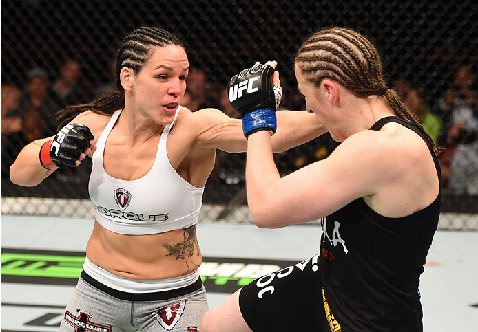 MONTREAL, QC - APRIL 25:   (L-R) Alexis Davis of Canada punches Sarah Kaufman of Canada in their women's bantamweight bout during the UFC 186 event at the Bell Centre on April 25, 2015 in Montreal, Quebec, Canada. (Photo by Josh Hedges/Zuffa LLC/Zuffa LLC