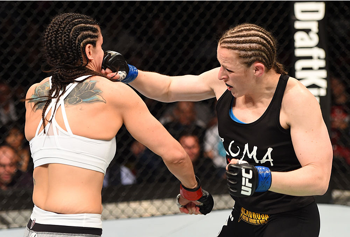 MONTREAL, QC - APRIL 25:   (R-L) Sarah Kaufman of Canada punches Alexis Davis of Canada in their women's bantamweight bout during the UFC 186 event at the Bell Centre on April 25, 2015 in Montreal, Quebec, Canada. (Photo by Josh Hedges/Zuffa LLC/Zuffa LLC