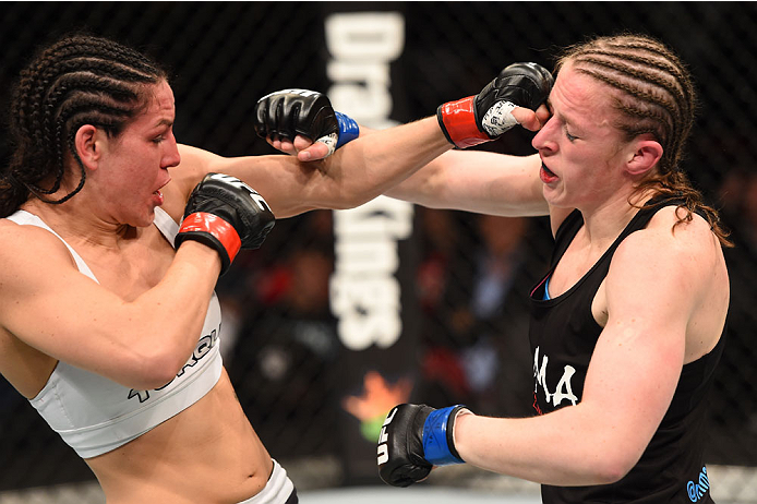 MONTREAL, QC - APRIL 25:   (L-R) Alexis Davis of Canada punches Sarah Kaufman of Canada in their women's bantamweight bout during the UFC 186 event at the Bell Centre on April 25, 2015 in Montreal, Quebec, Canada. (Photo by Josh Hedges/Zuffa LLC/Zuffa LLC