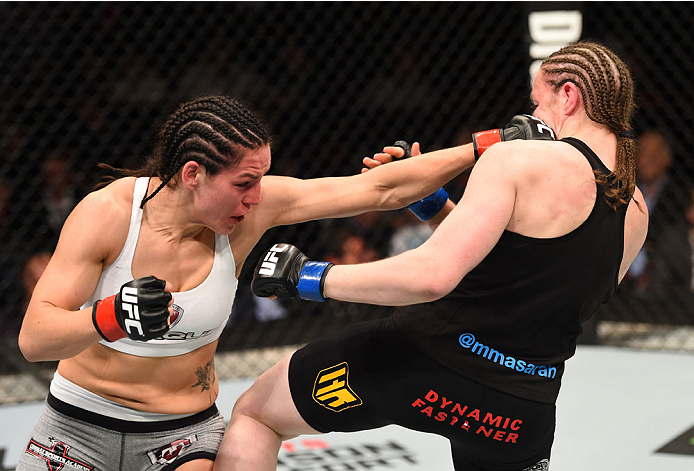 MONTREAL, QC - APRIL 25:   (L-R) Alexis Davis of Canada punches Sarah Kaufman of Canada in their women's bantamweight bout during the UFC 186 event at the Bell Centre on April 25, 2015 in Montreal, Quebec, Canada. (Photo by Josh Hedges/Zuffa LLC/Zuffa LLC