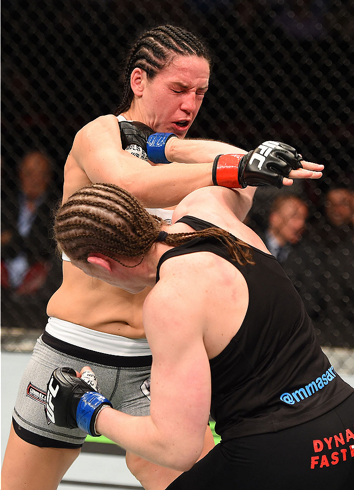 MONTREAL, QC - APRIL 25:   (R-L) Sarah Kaufman of Canada punches Alexis Davis of Canada in their women's bantamweight bout during the UFC 186 event at the Bell Centre on April 25, 2015 in Montreal, Quebec, Canada. (Photo by Josh Hedges/Zuffa LLC/Zuffa LLC