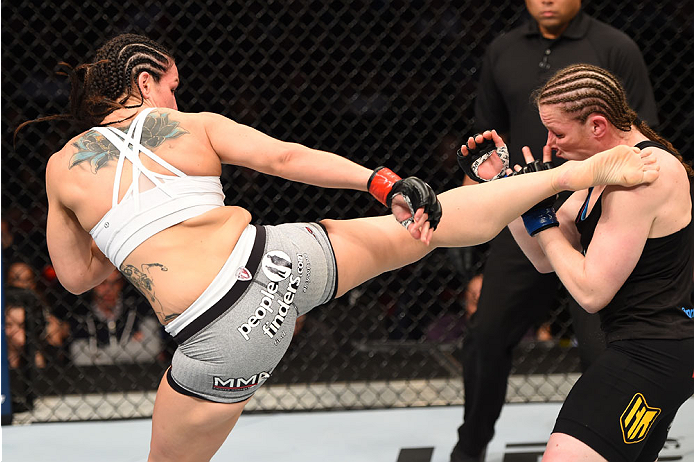 MONTREAL, QC - APRIL 25:   (L-R) Alexis Davis of Canada kicks Sarah Kaufman of Canada in their women's bantamweight bout during the UFC 186 event at the Bell Centre on April 25, 2015 in Montreal, Quebec, Canada. (Photo by Josh Hedges/Zuffa LLC/Zuffa LLC v