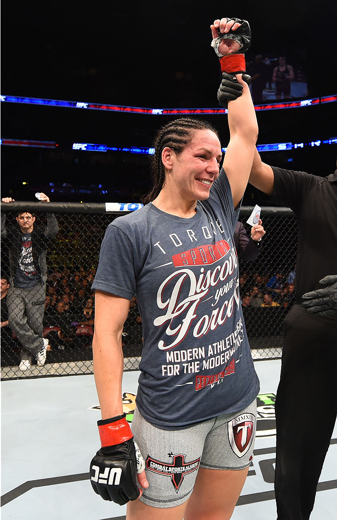 MONTREAL, QC - APRIL 25:   Alexis Davis of Canada reacts after her submission victory over Sarah Kaufman of Canada in their women's bantamweight bout during the UFC 186 event at the Bell Centre on April 25, 2015 in Montreal, Quebec, Canada. (Photo by Josh