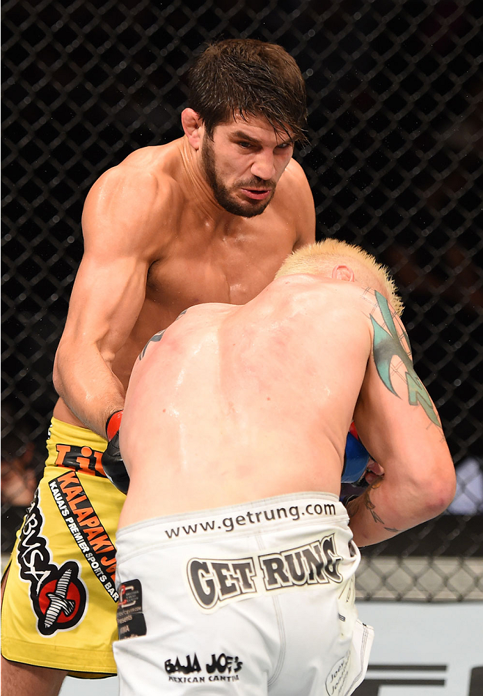 MONTREAL, QC - APRIL 25:   (L-R) Patrick Cote of Canada punches Joe Riggs of the United Sates in their welterweight bout during the UFC 186 event at the Bell Centre on April 25, 2015 in Montreal, Quebec, Canada. (Photo by Josh Hedges/Zuffa LLC/Zuffa LLC v