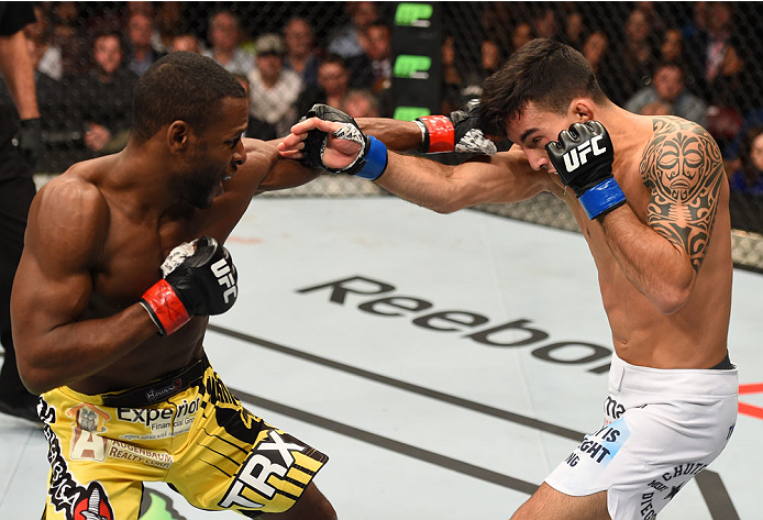 MONTREAL, QC - APRIL 25:   (L-R) Yves Jabouin of Canada punches Thomas Almeida of Brazil in their bantamweight bout during the UFC 186 event at the Bell Centre on April 25, 2015 in Montreal, Quebec, Canada. (Photo by Josh Hedges/Zuffa LLC/Zuffa LLC via Ge