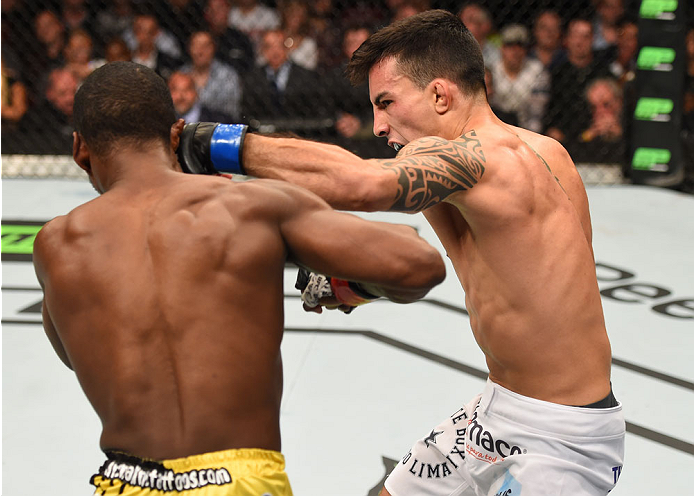 MONTREAL, QC - APRIL 25:   (R-L) Thomas Almeida of Brazil punches Yves Jabouin of Canada in their bantamweight bout during the UFC 186 event at the Bell Centre on April 25, 2015 in Montreal, Quebec, Canada. (Photo by Josh Hedges/Zuffa LLC/Zuffa LLC via Ge