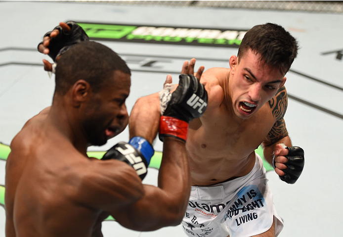 MONTREAL, QC - APRIL 25:   (R-L) Thomas Almeida of Brazil punches Yves Jabouin of Canada in their bantamweight bout during the UFC 186 event at the Bell Centre on April 25, 2015 in Montreal, Quebec, Canada. (Photo by Josh Hedges/Zuffa LLC/Zuffa LLC via Ge