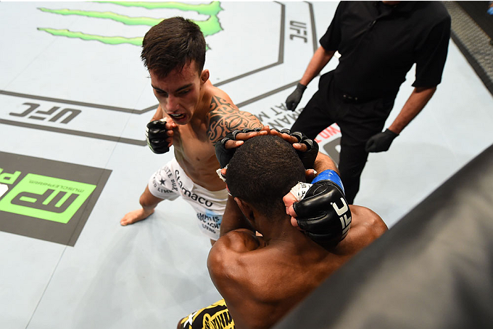 MONTREAL, QC - APRIL 25:   (L-R) Thomas Almeida of Brazil punches Yves Jabouin of Canada in their bantamweight bout during the UFC 186 event at the Bell Centre on April 25, 2015 in Montreal, Quebec, Canada. (Photo by Josh Hedges/Zuffa LLC/Zuffa LLC via Ge